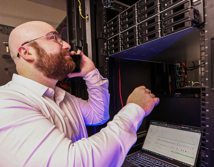 Darren checks rows and banks of switches for a local network